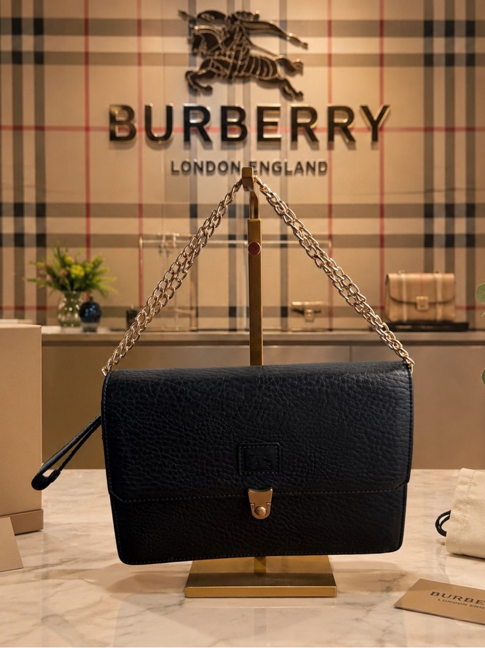 Authenticated card included with this Vintage Burberrys clutch black leather